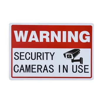 Старинный металлический знак, предупреждающий об использовании камер видеонаблюдения